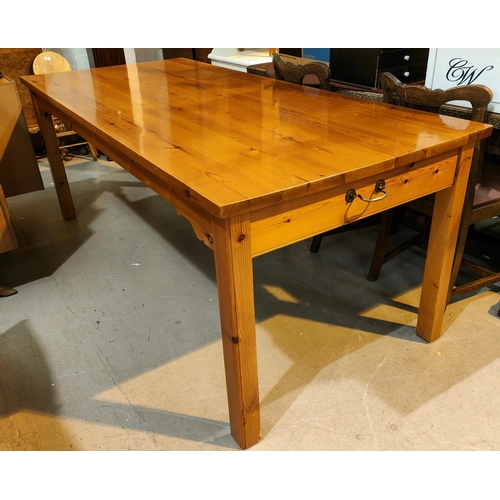 973 - A large rectangular pine dining table, square legs 200 x 90cm with 6 ladder back chairs in white