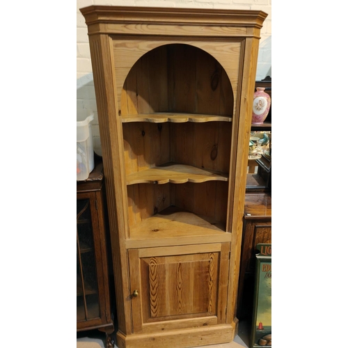 974 - A reproduction pine full height corner cupboard with 3 open shelves and cupboard below