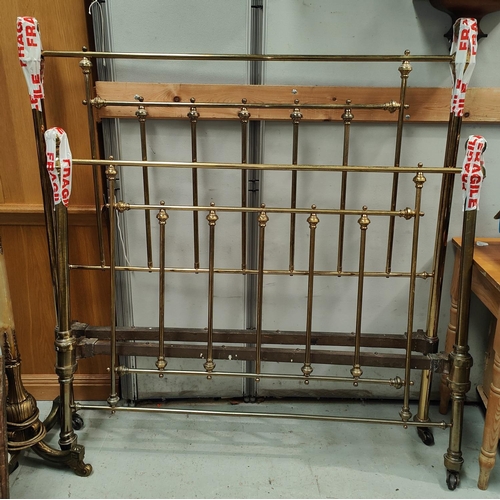 975 - A Victorian brass bed frame with circular finials and side irons