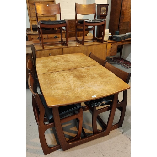 981 - A 1960's teak dining suite comp. rectangular extending table, 6 chairs with wide top rails and sideb... 