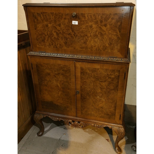 985 - A reproduction Queen Anne style burr walnut drinks cabinet with fall front double cupboard and cabri... 