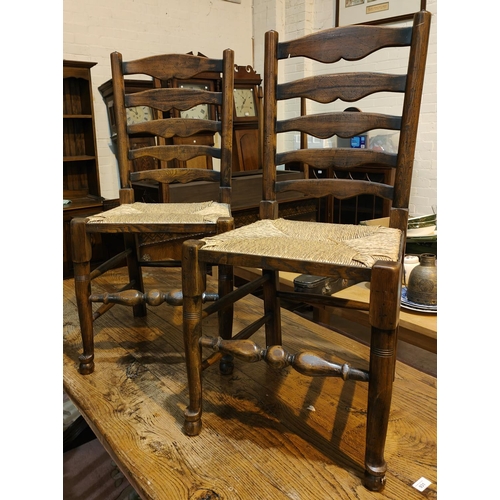 998 - A set of four good quality oak dining chairs with rush seats, turned legs etc and another similar ch... 