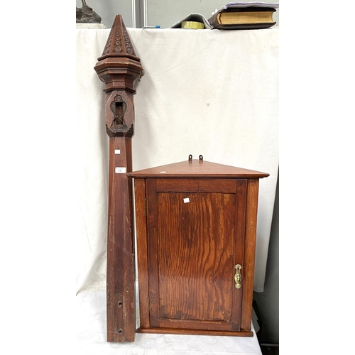 11 - A Victorian chamfered mahogany newel post; a small oak corner cupboard