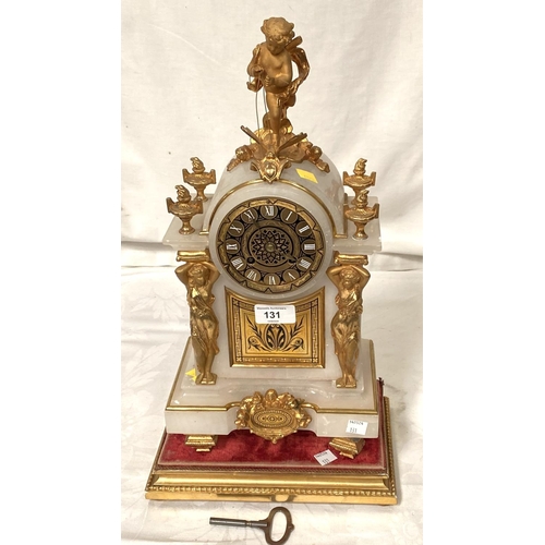 131 - A Louis XVI style white marble mantle clock with gilt metal cherub finial and mounts with base and s... 