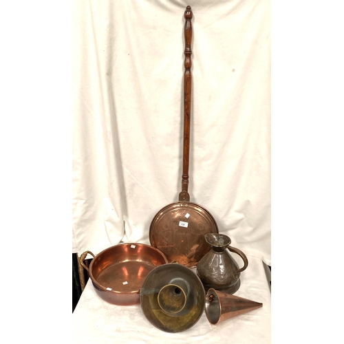 139 - A copper warming pan and a copper pan with side handles and other copper ornaments