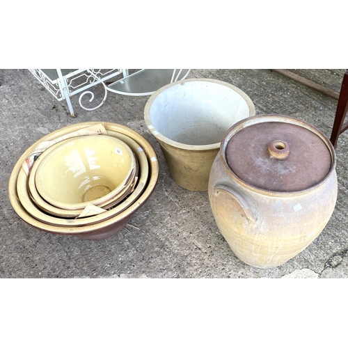 142 - A graduating set of 4 bread crocks and similar items