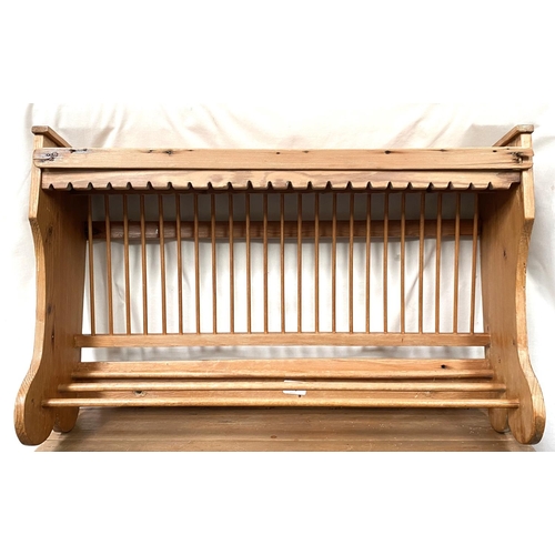 145 - 2 wall hanging pine plate racks; a 2 division cutlery tray ; a small glazed pine wall cupboard