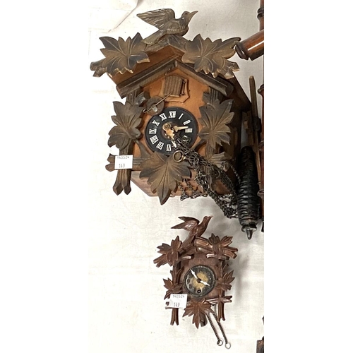 149 - A Vienna wall clock with bamboo style carved decoration chiming movement; A painted metal Japy clock... 