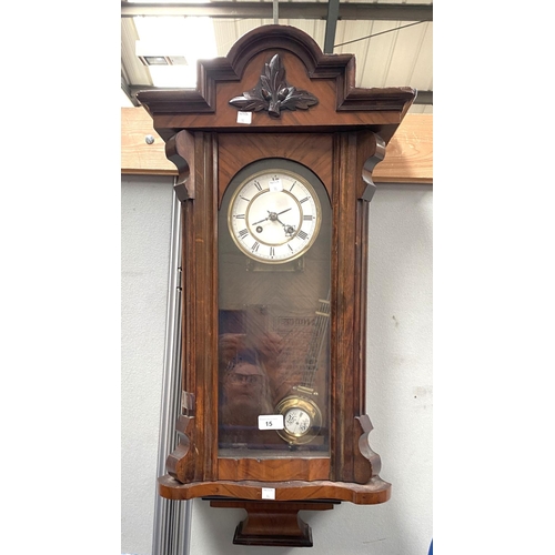 15 - A 19th century Vienna wall clock in walnut case, spring driven with strike