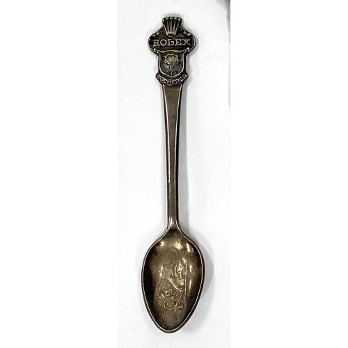 156 - Two white metal Rolex Bucherer teaspoons with Rolex crown finials and a white metal and mother of pe... 