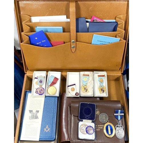 179 - Two suitcases of Masonic aprons, regalia, jewels etc, some silver examples