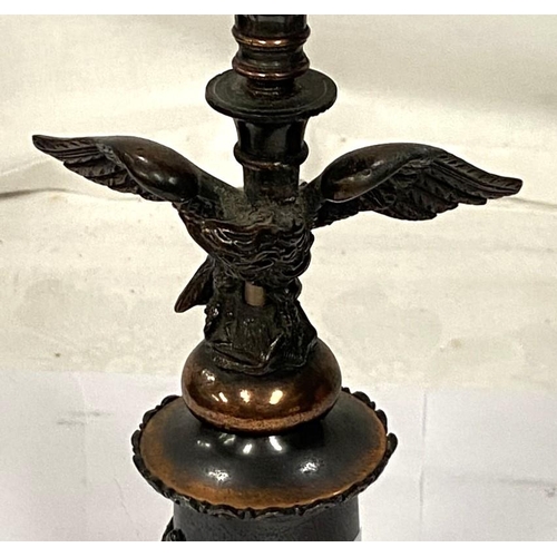 190A - A bronzed table lamp in the form of eagle perched on column with squared base, height 29cm