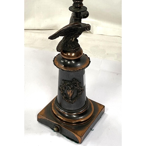 190A - A bronzed table lamp in the form of eagle perched on column with squared base, height 29cm