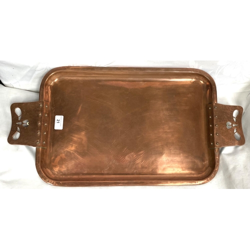 21 - A rounded rectangular Arts & Crafts style copper tray with riveted and pierced handles
