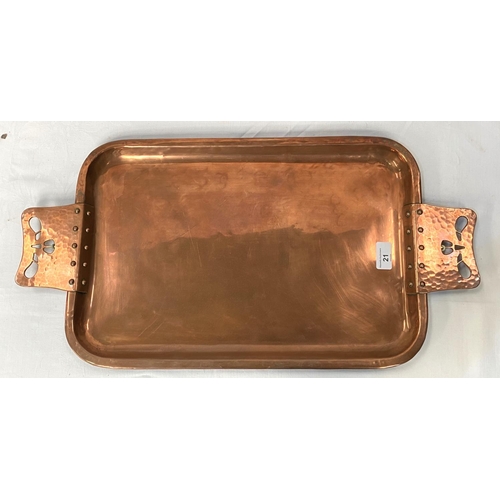 21 - A rounded rectangular Arts & Crafts style copper tray with riveted and pierced handles