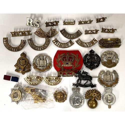 258 - A collection of military shoulder badges and buttons etc and a book on badges