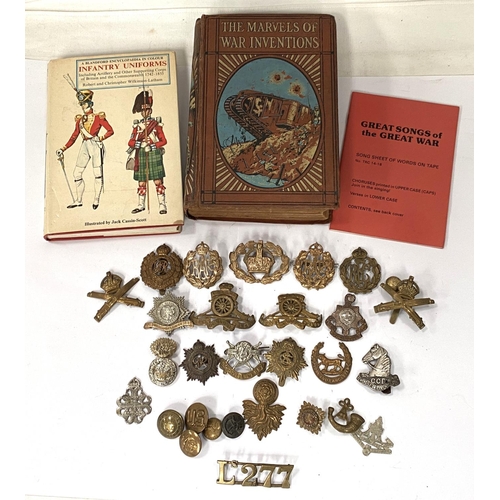 276 - A collection of military badges for various regiments etc and two hardback books