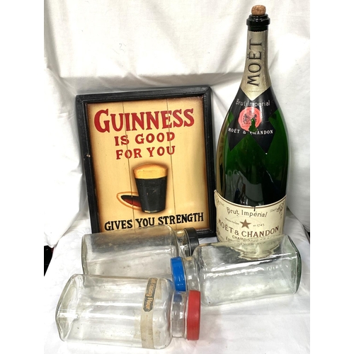 28 - A reproduction Guinness advertising sign, an Empty 900cl Moet & Chandon  display bottle etc