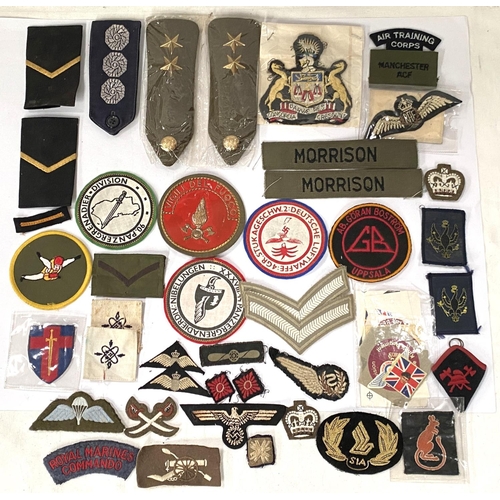 284 - A collection of military cloth shoulder badges and patches for various regiments etc