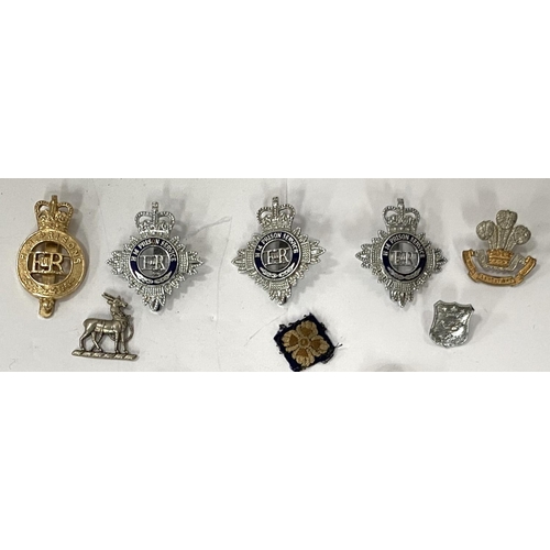 287 - A good selection of military and Police badges a and buttons etc