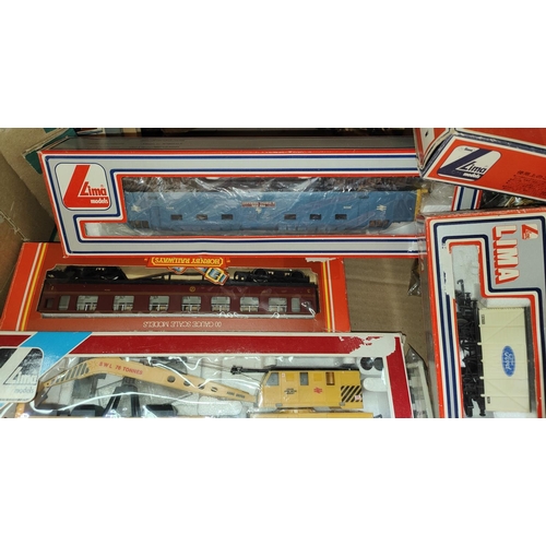 324 - A collection of Hornby and Lima boxed carriages, trucks etc 