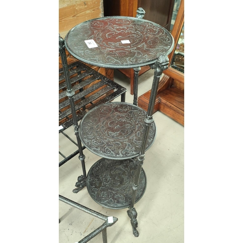34 - A 3 height metal pan stand; 4 various trivets