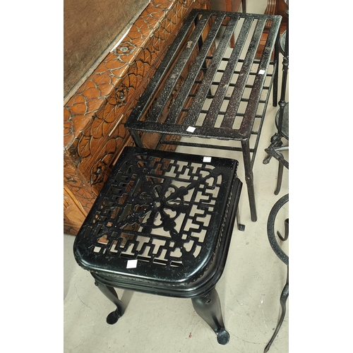 34 - A 3 height metal pan stand; 4 various trivets