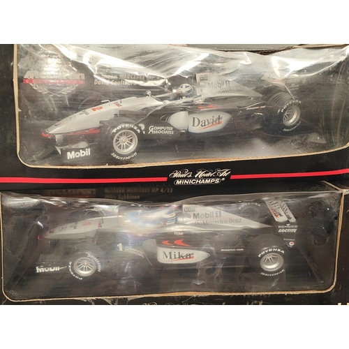 344 - Two Mini Champs Paul's Model Art 1/18 scale Maclaren F1 Cars in boxes (boxes worn) and a Hot Wheels ... 