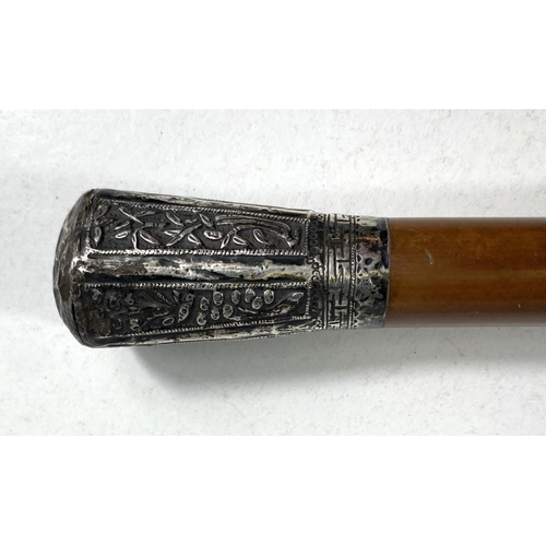 406 - A Chinese military style walking cane with white metal embossed final with plants etc