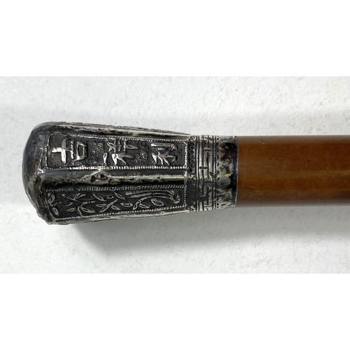 406 - A Chinese military style walking cane with white metal embossed final with plants etc