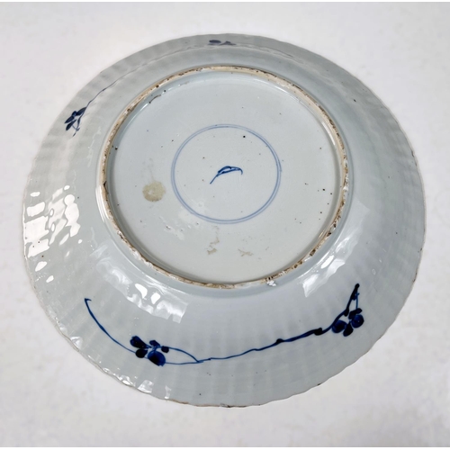 416 - A Chinese Kangxi period ribbed and moulded blue and white dish, leaf mark to base, diameter 27cm