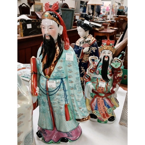 425 - Three 20th century Chinese figures of immortals and a female figure with fan