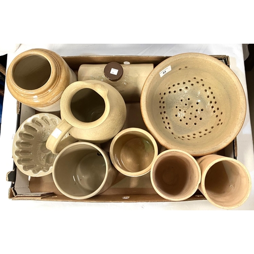 44 - A selection of kitchen stoneware including storage jars, jelly mould, colander etc