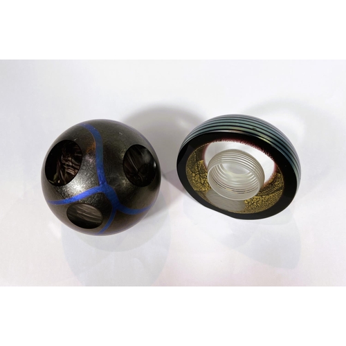 502 - Paperweights: Two Okra glass studios paperweights, one dark lustre with blue lines and sliced areas ... 