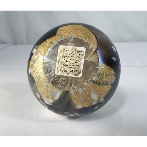 510 - Isle of Wight Glass: three labelled paperweights with gold leaf and varying colours and an iridescen... 