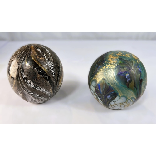 511 - Johnathan Harris Studio Glass: a black and white paperweight with gold leaf highlights, signed and l... 