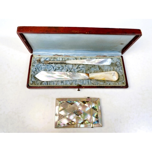 55 - A mother of pearl and abalone shell decorated card case; a boxed mother of pearl letter opener and a... 