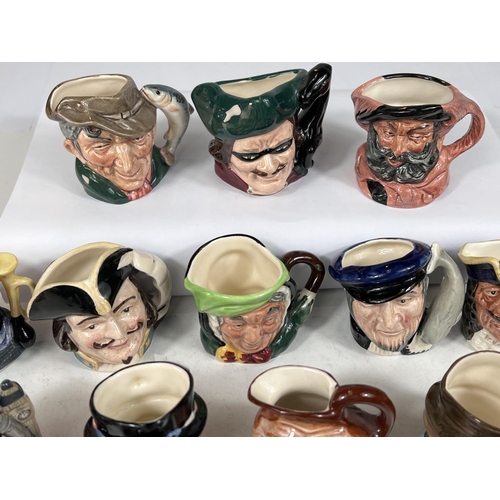 556 - 18 small Royal Doulton character jugs