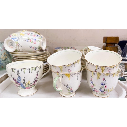 569 - A Foley part tea service decorated with Hollyhocks etc (approx. 40 pieces)