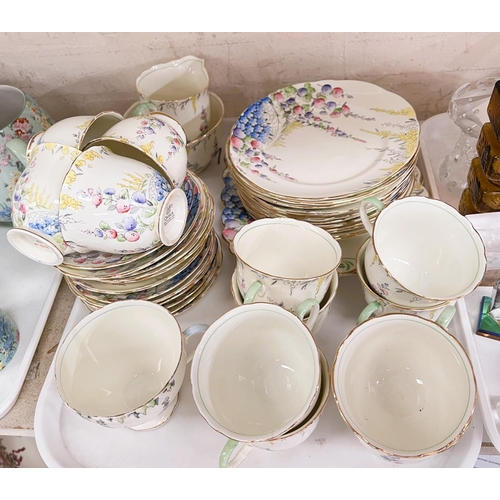 569 - A Foley part tea service decorated with Hollyhocks etc (approx. 40 pieces)