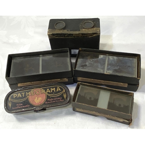 58 - An early 20th century stereoscope viewer and 3 boxes of glass viewing slides and a 