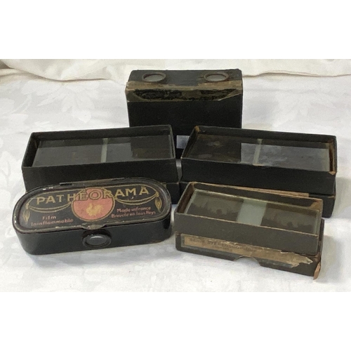 58 - An early 20th century stereoscope viewer and 3 boxes of glass viewing slides and a 