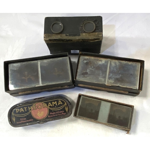 58 - An early 20th century stereoscope viewer and 3 boxes of glass viewing slides and a 