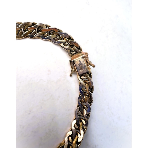 600 - A modern yellow metal bracelet formed from inter twined links stamped 375, 13gm