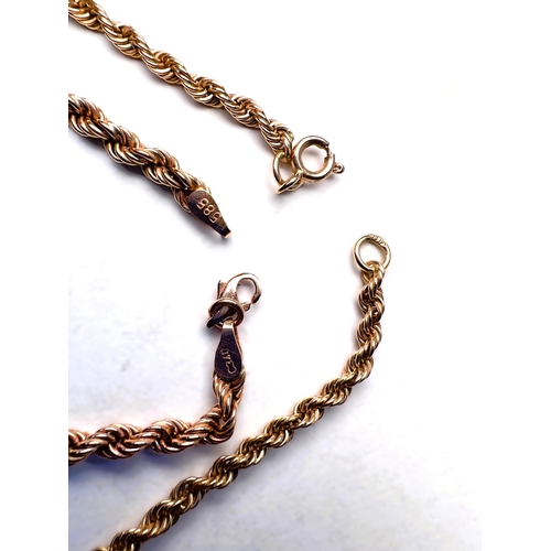 602 - A rope twist neck chain and matching bracelet stamped 585, 23.75gm