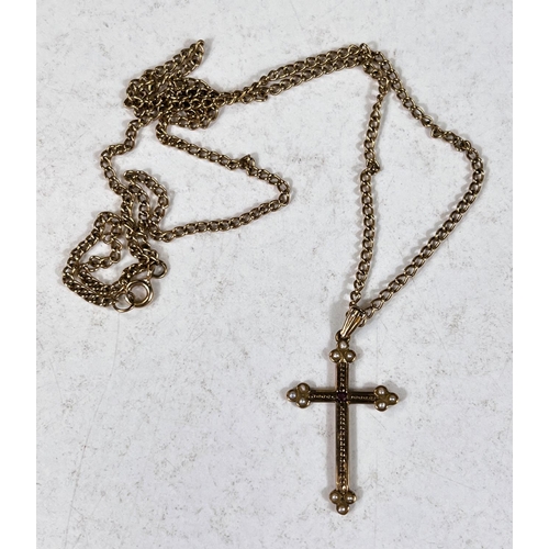 604 - A seed pearl and ruby set yellow metal cross pendant stamped 375 on curb link chain stamped 375, 9gm