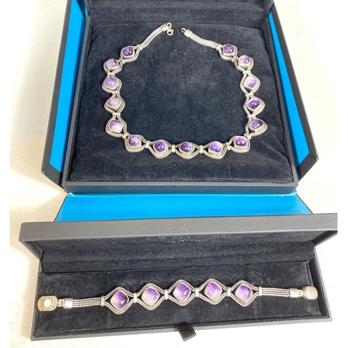 611 - A white metal necklace and bracelet set with Blue John cabochon cut stones, stamped 925