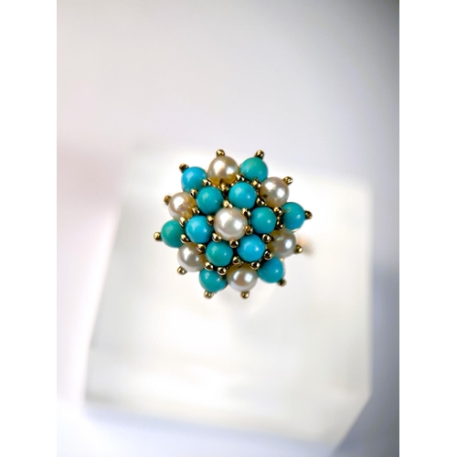 620 - A 9 carat hallmarked gold ring with seed pearls and turquoise in tiered setting, 3.4gm, size N/O