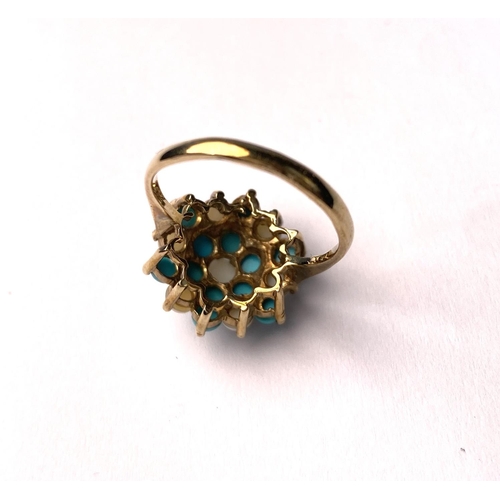 620 - A 9 carat hallmarked gold ring with seed pearls and turquoise in tiered setting, 3.4gm, size N/O