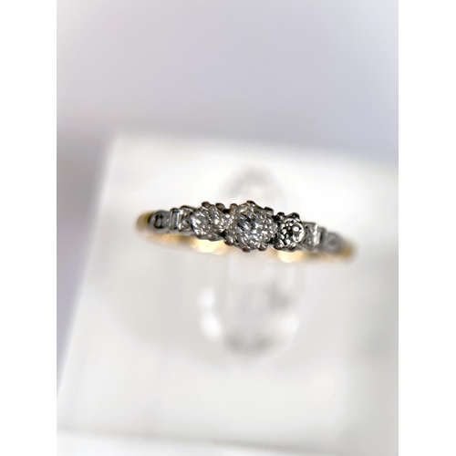 624 - An 18 carat hallmarked gold dress ring with 3 illusion set diamonds in platinum surround, 2.5gm, siz... 